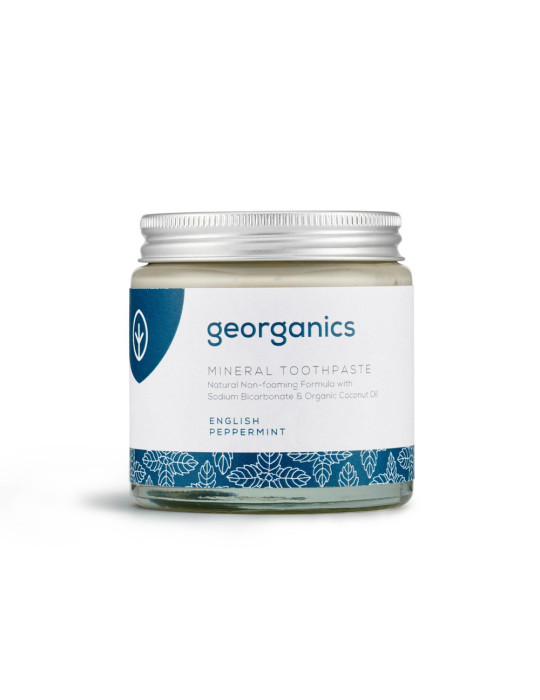 Mint-flavored toothpaste in a glass jar